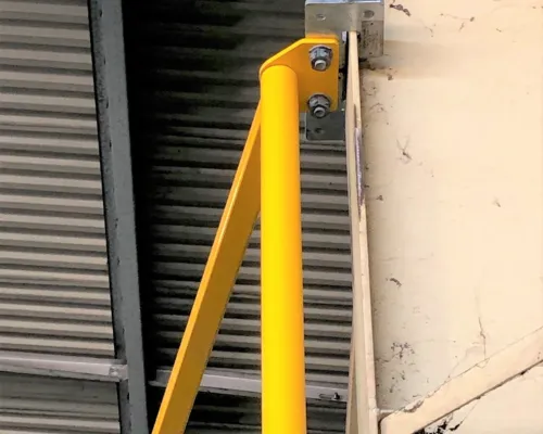 Davit arm attached to steel column with Skopit beam clamp